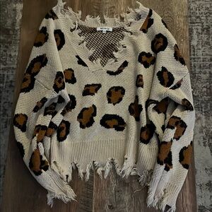 Miracle Cream V-Neck Sweater with Distressed Leopard Print